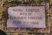 A headstone for Nancy Cooper, wife of Benjamin Simpson, is shown. AI generated content
