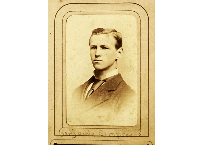 A man wearing a suit and tie is the subject of this vintage photograph. AI generated content