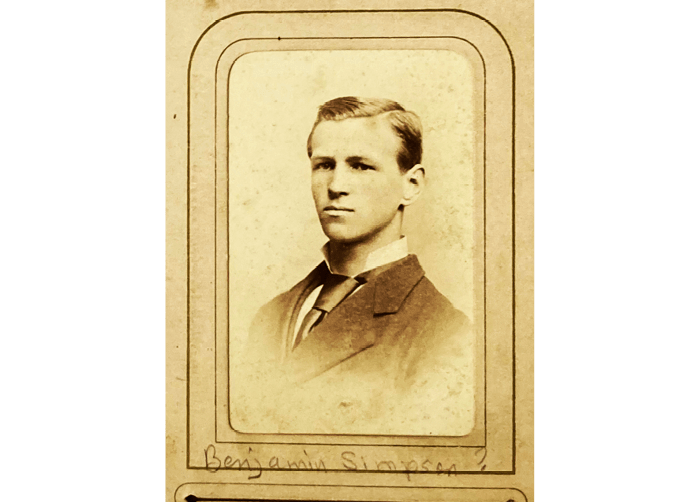 A man wearing a suit and tie is the subject of this vintage photograph. AI generated content